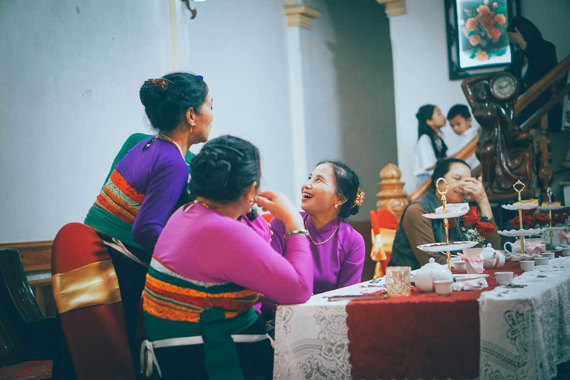 A group of relatives gossiping A group of relatives gossiping