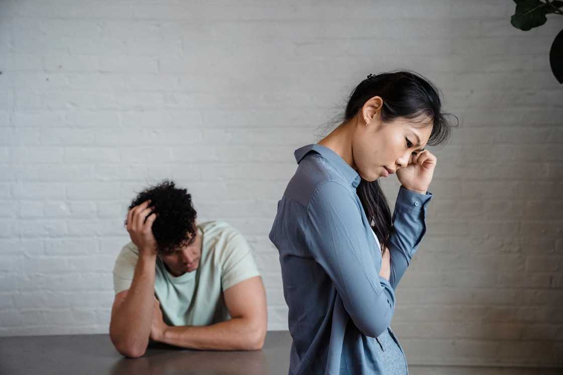 A man and a woman look dejected during a conversation. A man and a woman look dejected during a conversation.