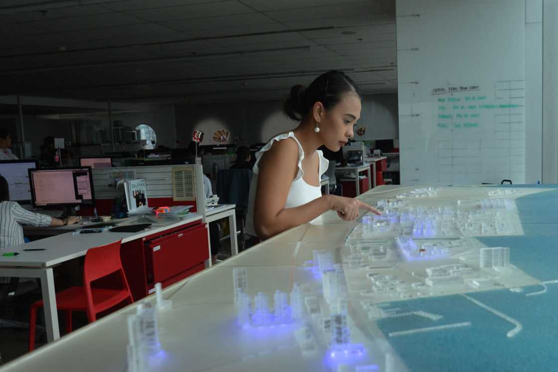 Lady sits in a plaza