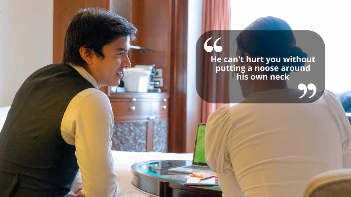 A man and woman talking in an office A man and woman talking in an office