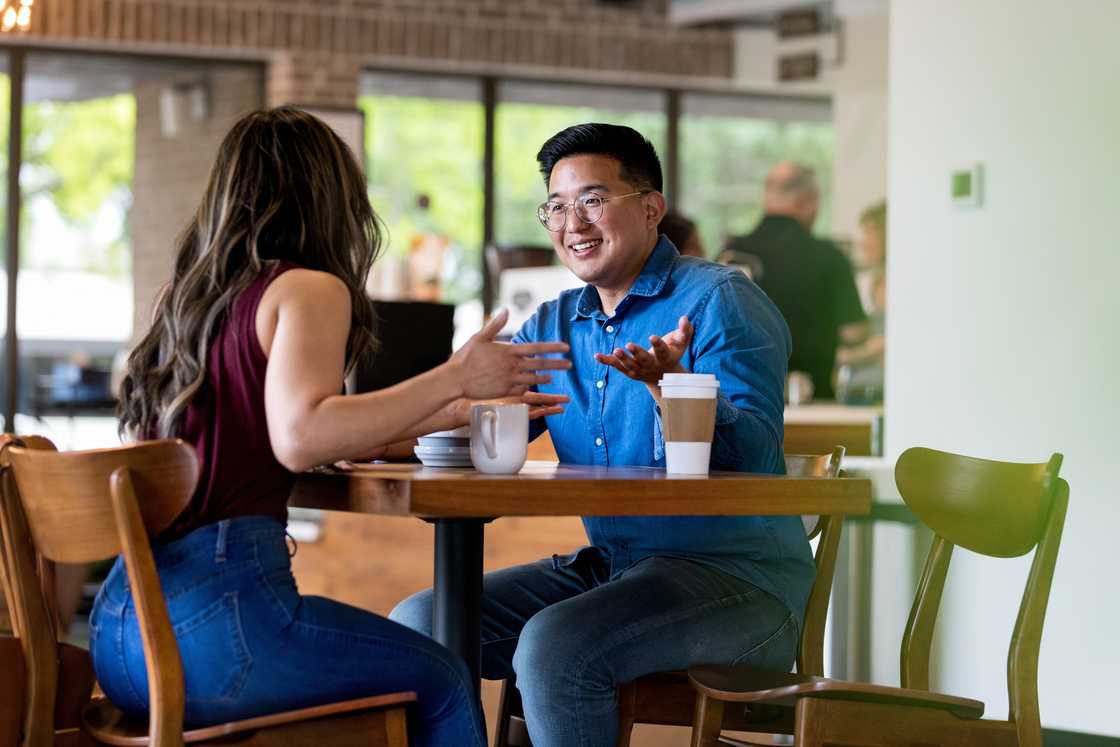 A man and woman at a cafe