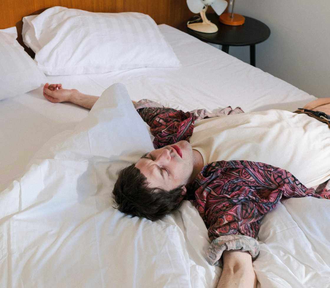 A tired man taking a nap at home