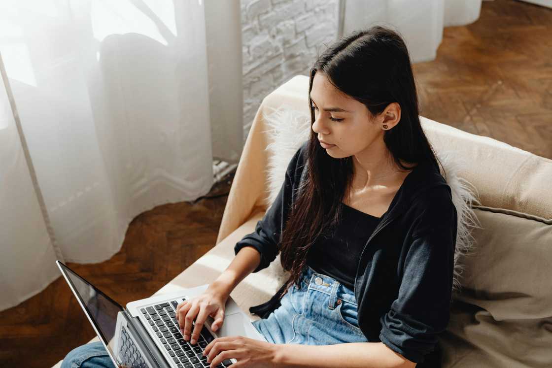 A woman using a laptop at home