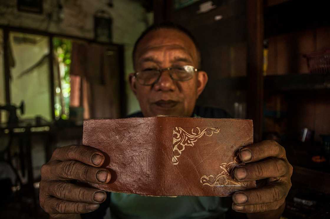 Man opens a small diary Man opens a small diary