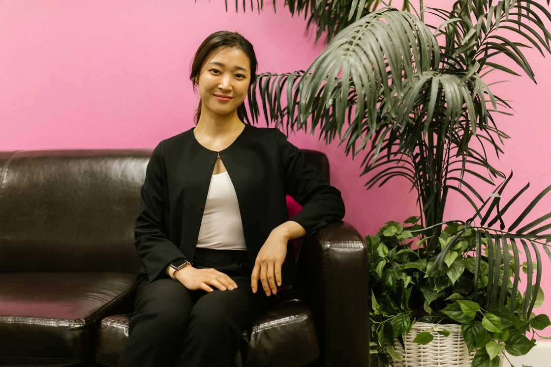 A smiling woman posing in her office A smiling woman posing in her office