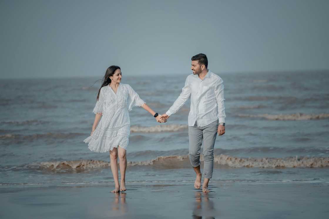 A happy couple holding hands A happy couple holding hands