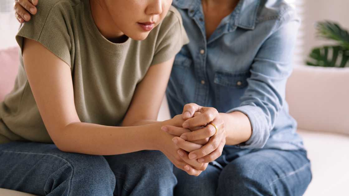 A lady is crying while talking to her boss A lady is crying while talking to her boss