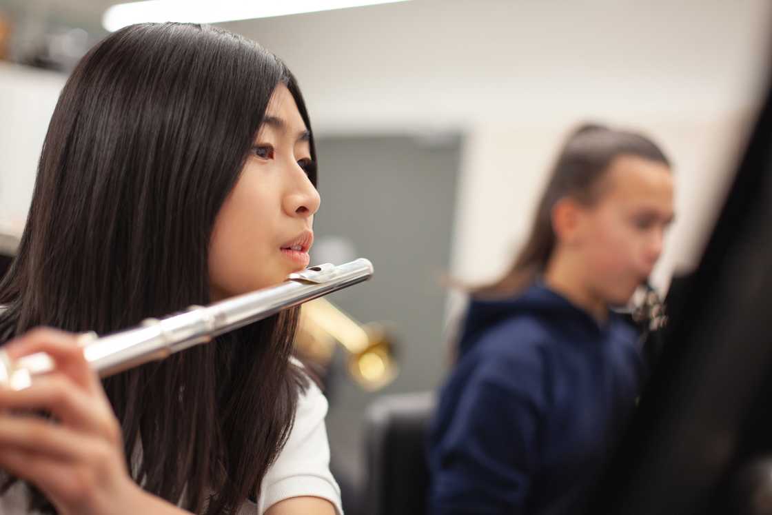 Music pupils playing flute Music pupils playing flute