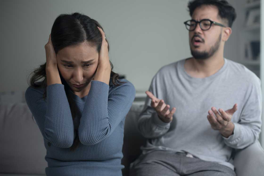 Husband and wife fighting at home Husband and wife fighting at home