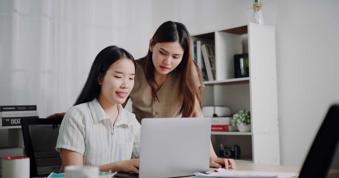 Two ladies in an office Two ladies in an office
