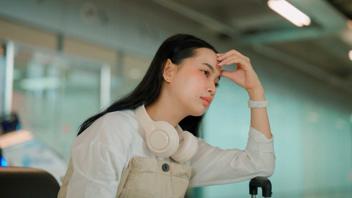 Worried mid adult woman on a airport Worried mid adult woman on a airport
