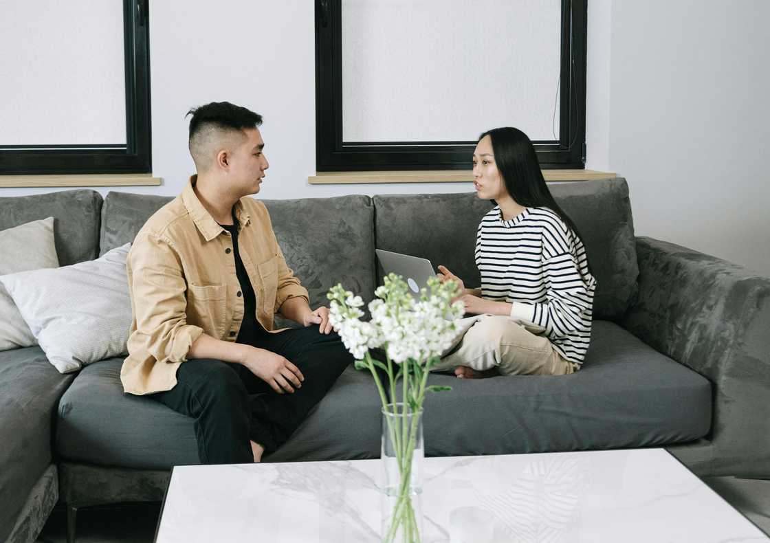 A couple talking indoors A couple talking indoors