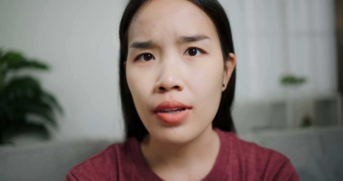A young woman feeling angry and irritated. A young woman feeling angry and irritated.