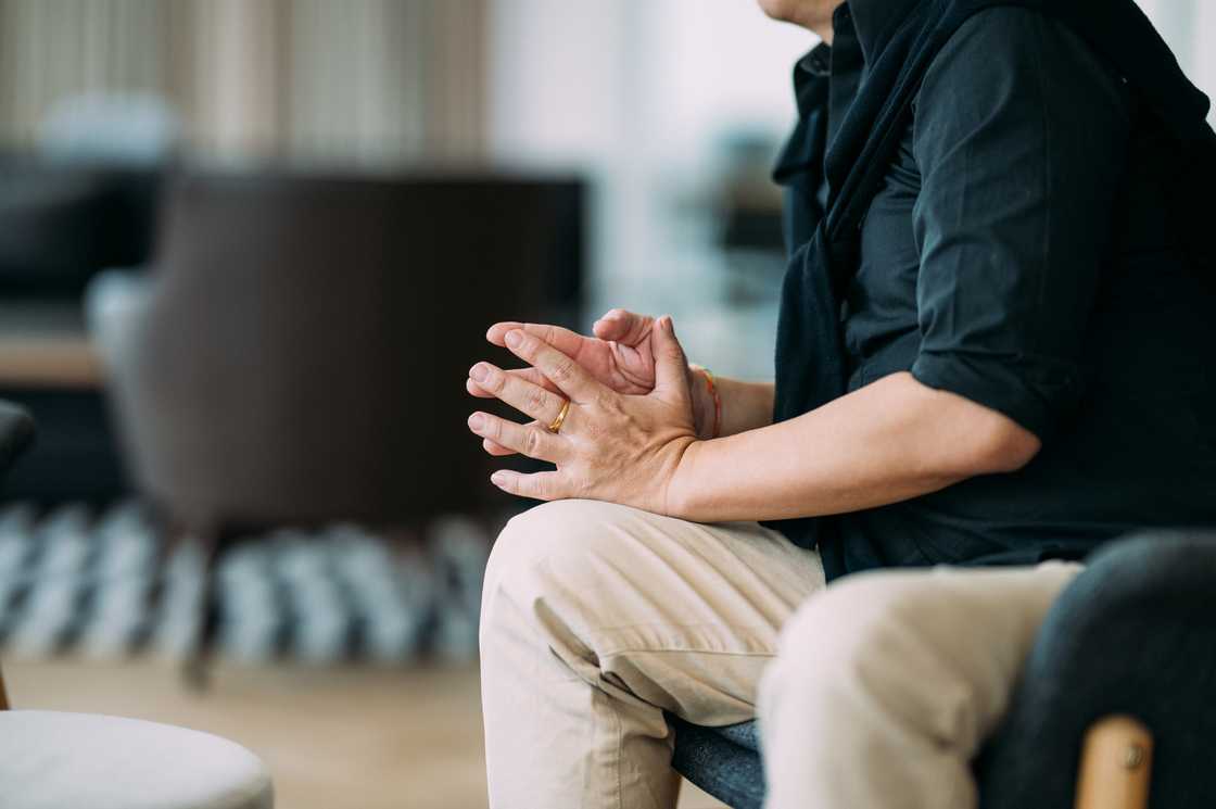 A man with stiff dry fingers