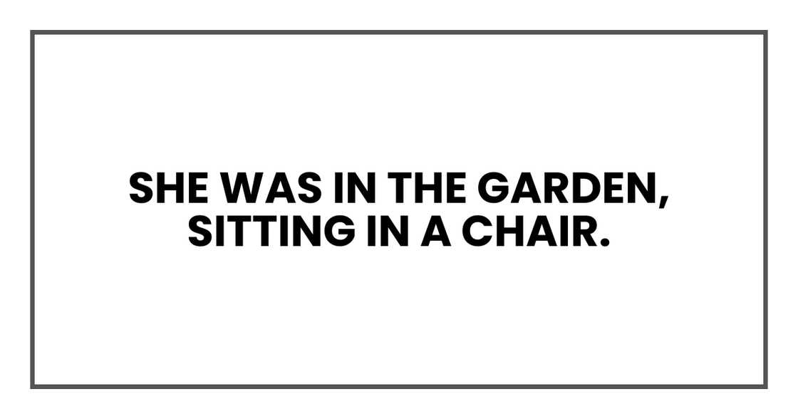 She was in the garden, sitting in a chair