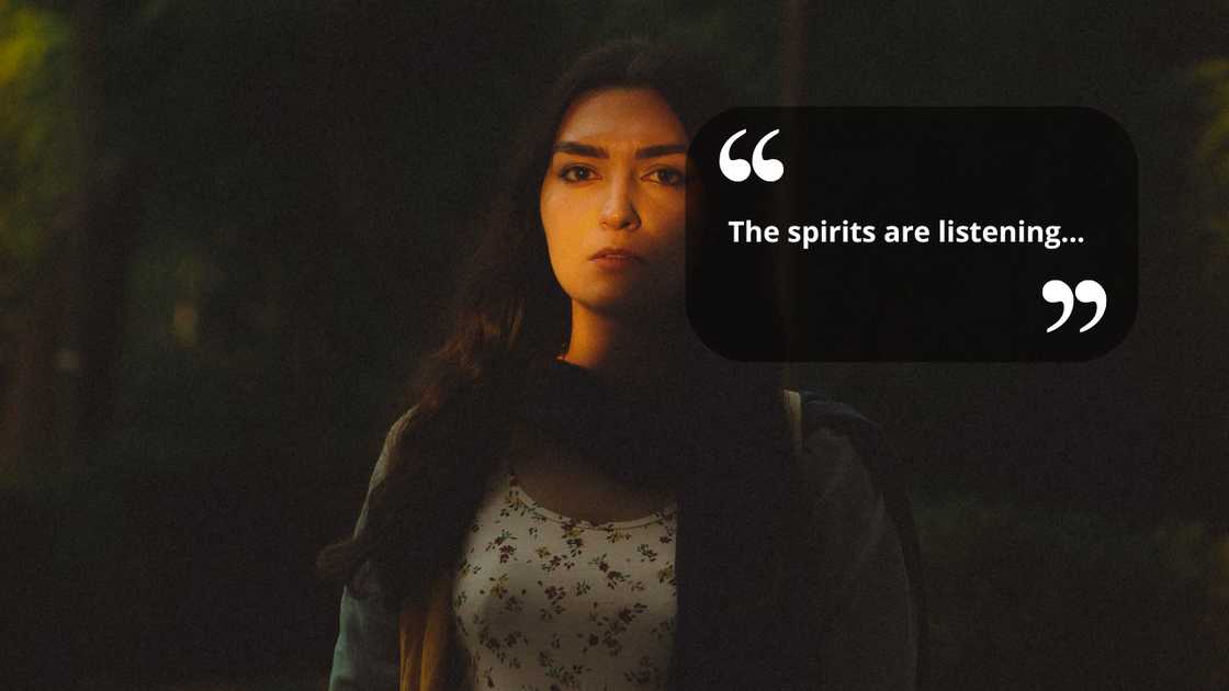 A woman standing in a dark room