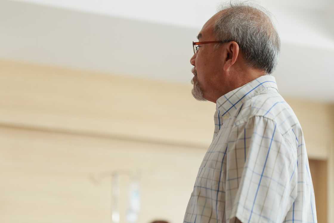 An elderly man waiting for check up in an hospital