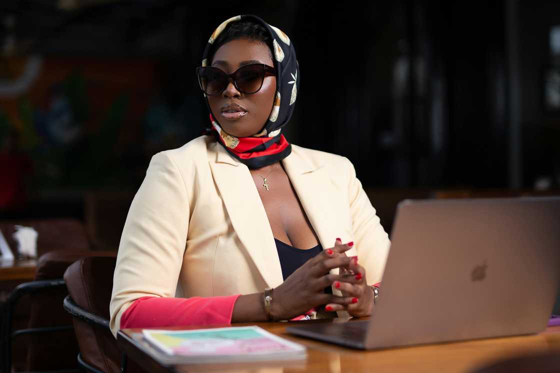 A black woman in a head scarf A black woman in a head scarf