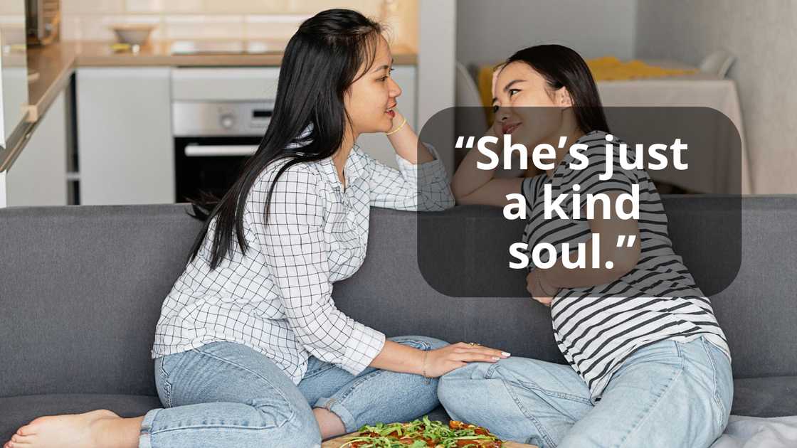 Women having a conversation indoors Women having a conversation indoors