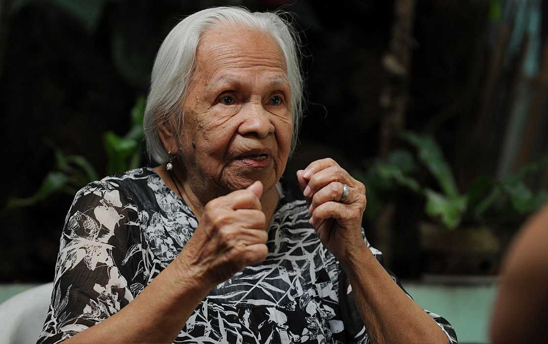 Filipino grandmother with raised fists. Filipino grandmother with raised fists.