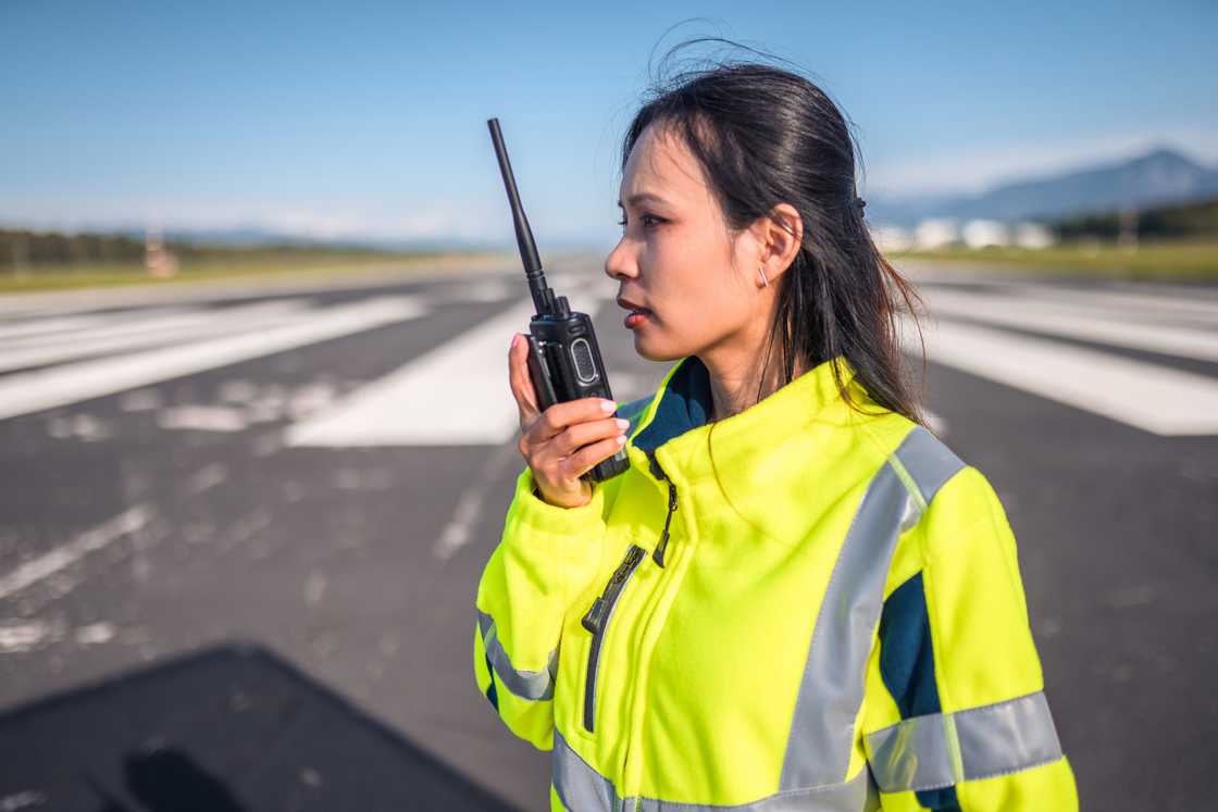 A female traffic officer talking on radio