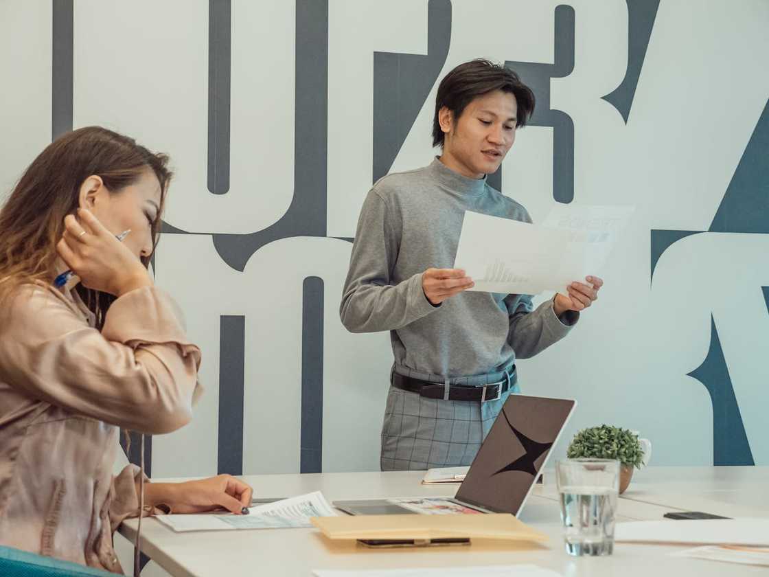People work in an open-plan office at night.
