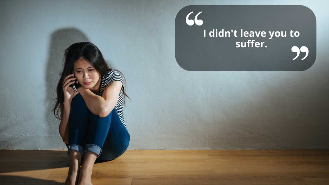 A sad young woman talking using a smart phone while sitting on floor