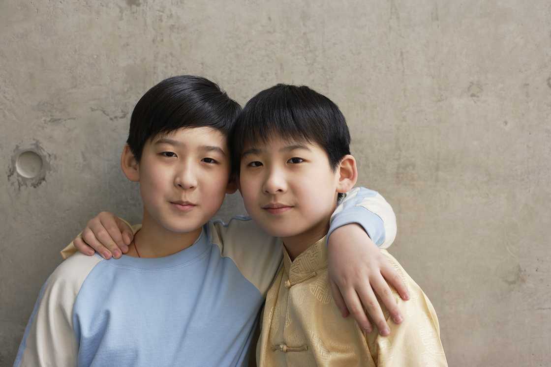 Two brothers are hugging Two brothers are hugging