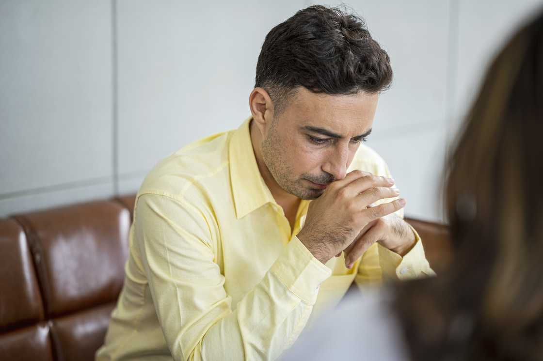A tense employee in a meeting