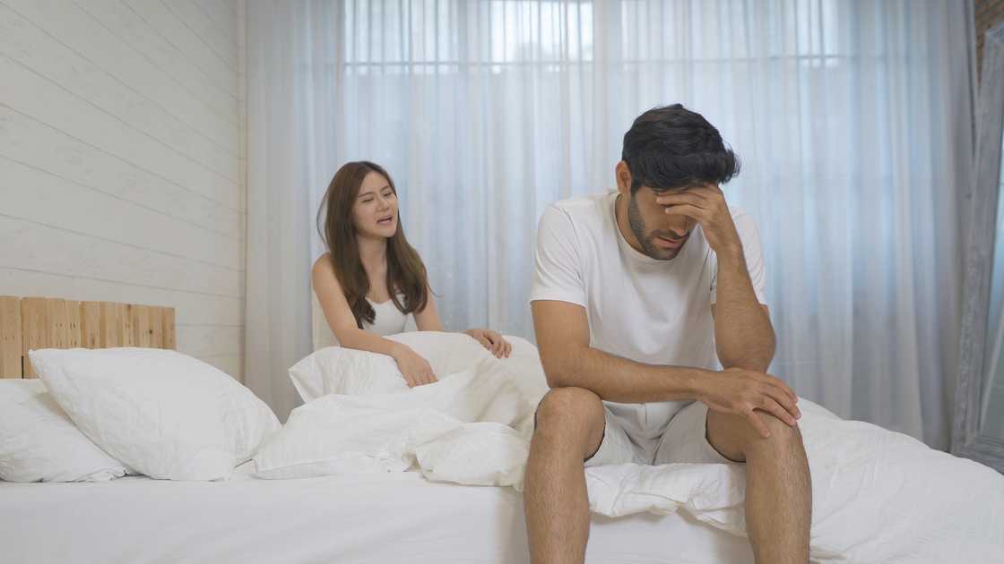 A couple arguing in the bedroom