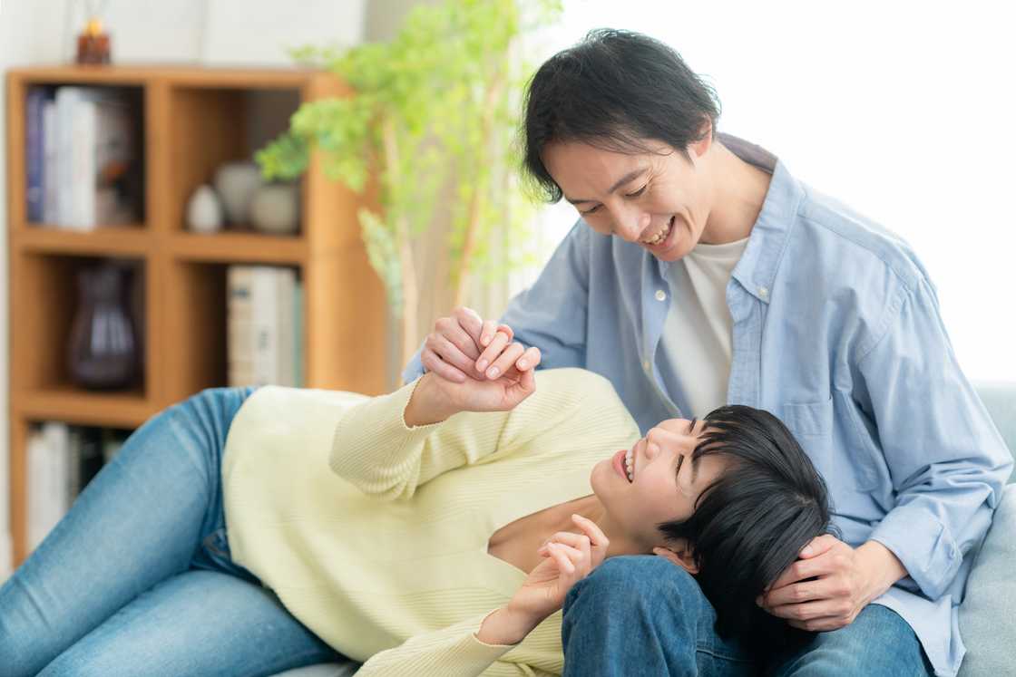 A young couple relaxing in a room A young couple relaxing in a room