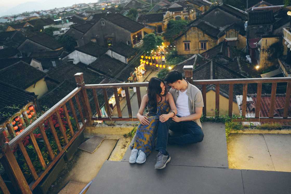 A couple talking on the rooftop