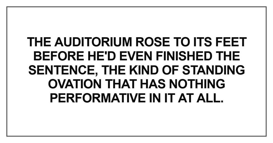 The auditorium rose to its feet