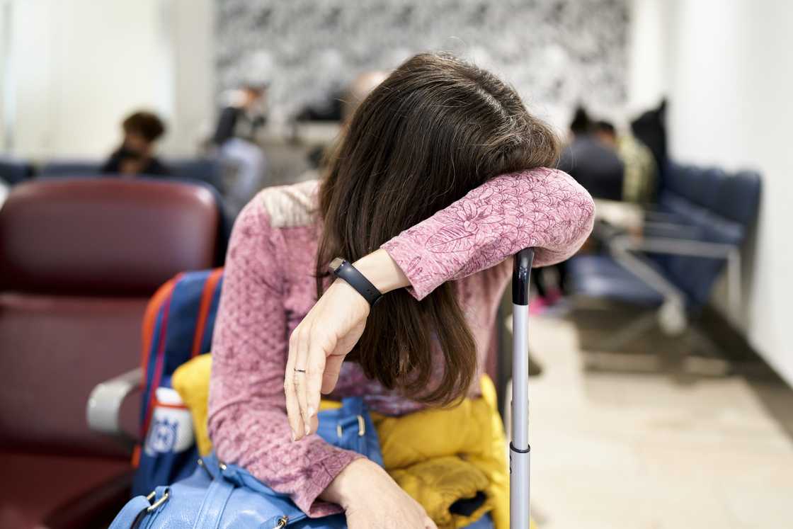 A worried woman in an airport