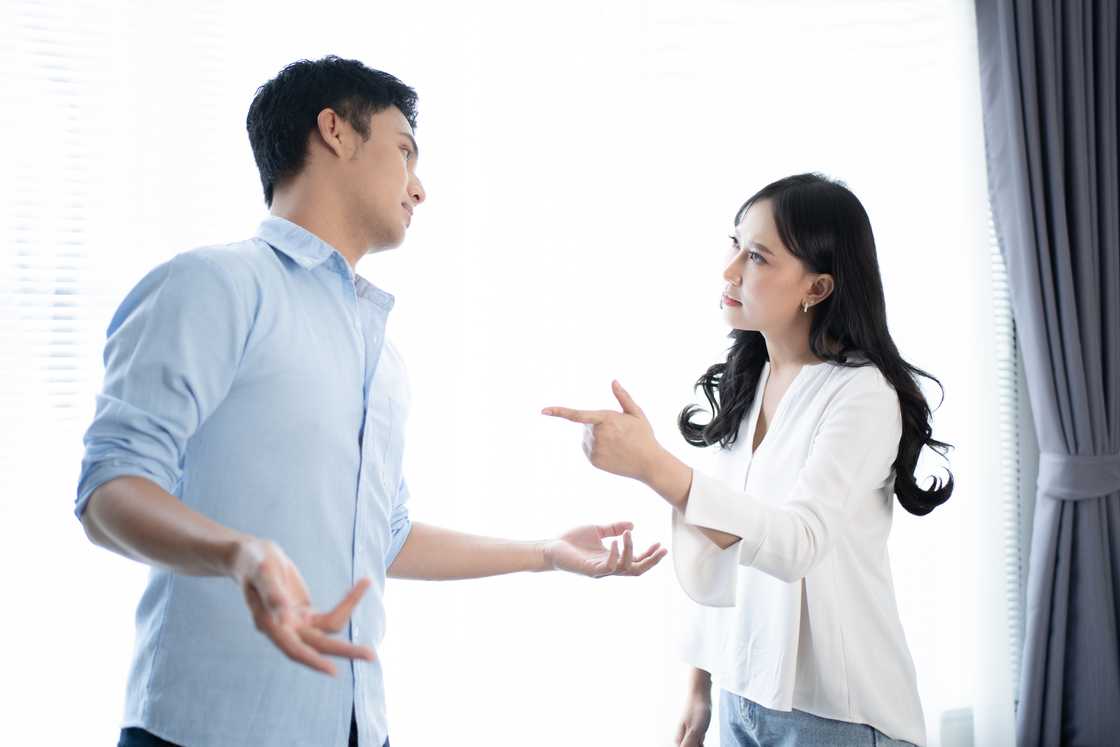 A man and woman quarrel at home. A man and woman quarrel at home.