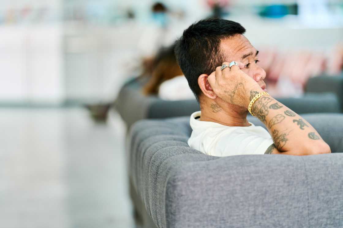 A man waiting in line in an hospital A man waiting in line in an hospital