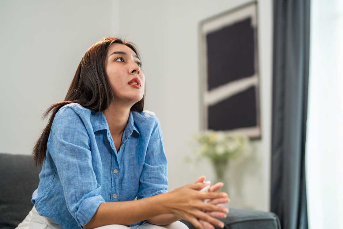 A woman looking thoughtful and pensive
