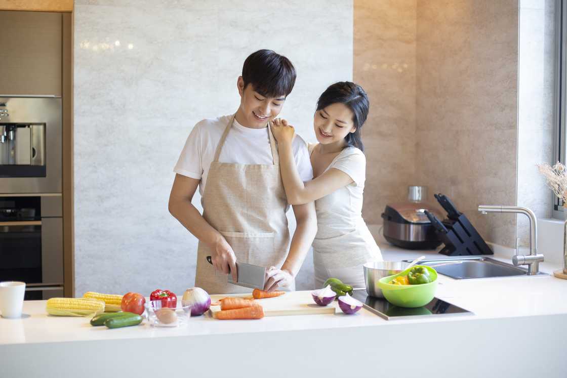 A couple cooking A couple cooking