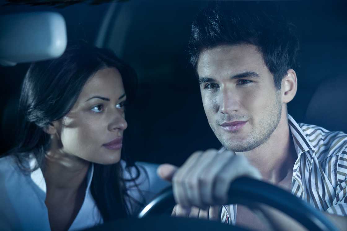 A woman arguing with a man while looking at him in his eyes A woman arguing with a man while looking at him in his eyes