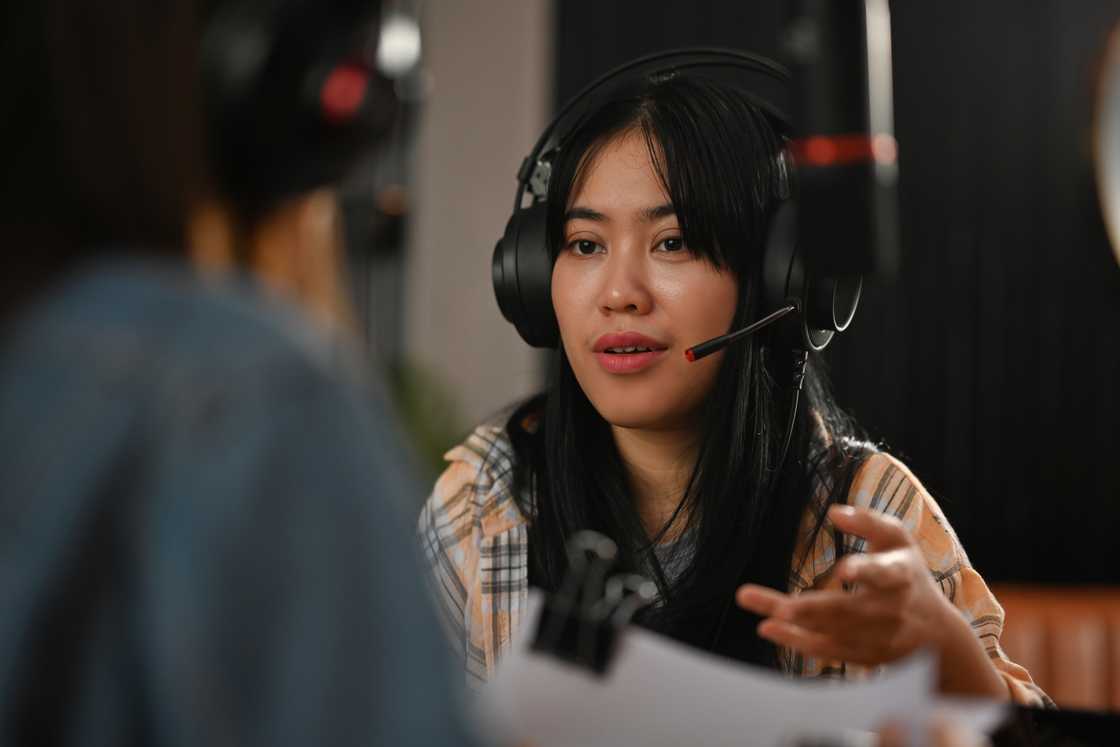 A lady during a radio interview A lady during a radio interview