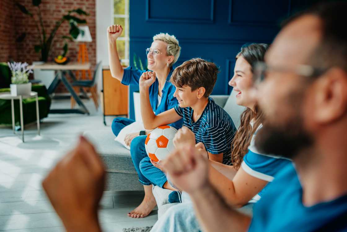 A family watching football