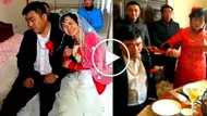 Napilitan lang! Asian groom acts miserably during wedding ceremony with his elderly bride