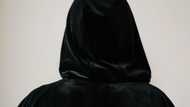 At my wedding, an elderly woman in a black robe appeared & pointed at my groom