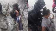 Dalawang lalaki na-trap sa imburnal sa QC, na-rescue sa gitna ng ulan