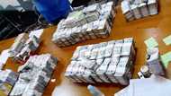 Photos of cash bundles presented in House hearing on flood control anomalies