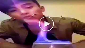 Painful epic fail! Clumsy man accidentally burns himself while attempting to drink flaming shot