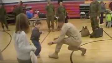 A boy with cerebral palsy walks to his Marine dad for the first time after not seeing him in over a year!