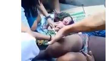 Young nurse earns praise of netizens after helping 'taong-grasa' deliver baby on the street