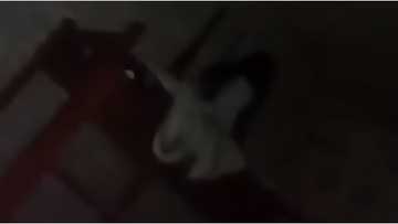 Alleged white lady, caught on camera inside a boarding house