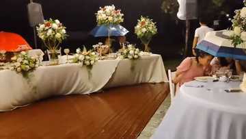 Video ng maulan na wedding reception sa Cebu, viral; Mga guests, tuloy lang sa pagkain kahit basang-basa na
